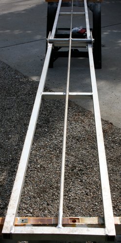 Photo of full length stiffening rod on underside of teeter